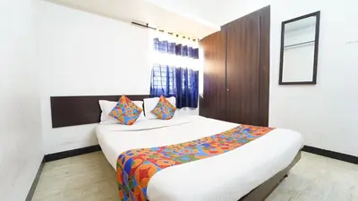 a bedroom with a large bed in a room at Aangal residency in Coimbatore