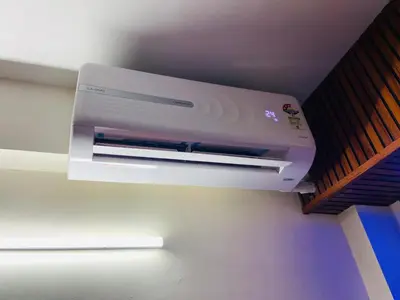 a white printer is hanging from a ceiling at Flat in Guruvayur- Sooryamadhavam Apartments- Family only in Guruvāyūr
