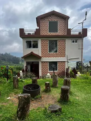 a house with a bunch of logs in front of it at Hideaway Home43 in Ooty