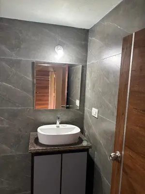 a bathroom with a sink and a mirror at Estate stay near Dubare elephant camp, friendly for remote workers in Siddapur