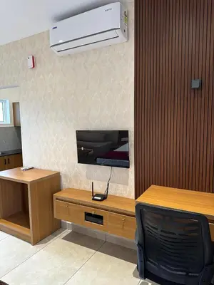 a room with a desk and a heater on the wall at Rivera resort and wellness center in Kodanad