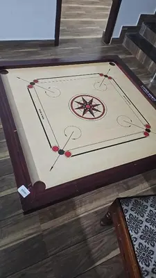 a table with a clock on it on the floor at Mount Wave Holiday Pool Villa in Wayanad