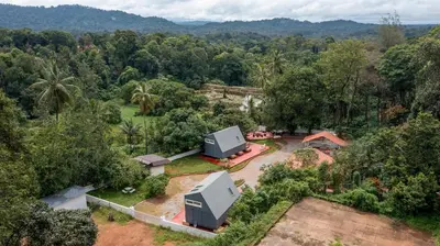 an aerial view of a house in the forest at Lolo's by Raho - Loft Stay in Coorg in Ammatti