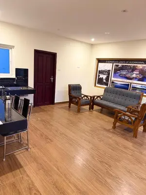 a living room with a couch and a piano at LaFiesta in Kodaikānāl