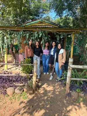 a group of women posing for a picture at Jungle Mist Cottages in Masinagudi