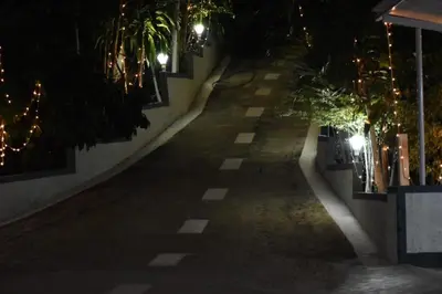 an empty street at night with lights at South point in Ammatti