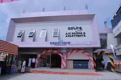 a facade of a building with people standing outside at AZURE stay happy in Pudunagaram
