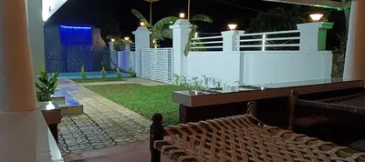 a room with a white fence and a bench at Heaven Cloud Stay Hub Attappadi in Attappādi
