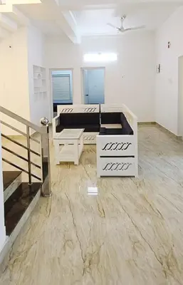 a living room with a couch and a table at Heaven Cloud Stay Hub Attappadi in Attappādi