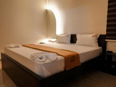a bedroom with a large bed in a room at Amaira Studio living - Coimbatore in Coimbatore