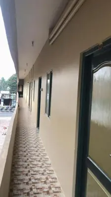 an empty hallway of a building with a door at Padma residency in Coimbatore