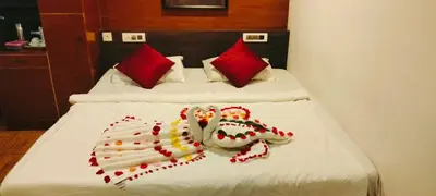 a bed with a number made out of red pillows at Rendezvous Jungle Resort in Sultan Bathery