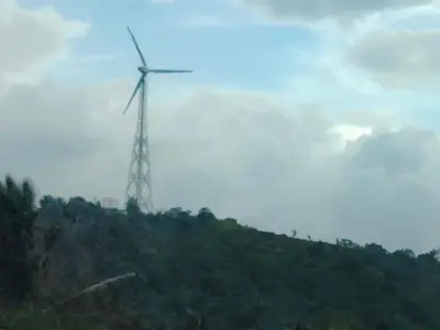 a wind turbine on top of a hill at Airin's Villa in Agali