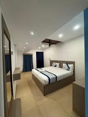a bedroom with a large bed in a room at Kadale Boutique Beach Stay in Kannur