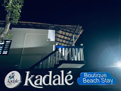 a set of stairs in front of a house at Kadale Boutique Beach Stay in Kannur