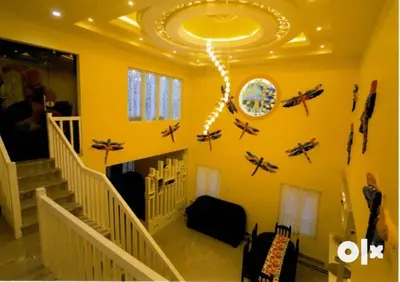 a room with a staircase with airplanes on the wall at Charis Villa and Guest house 5bed 4bath in kunnamkulam in Kunnamkulam