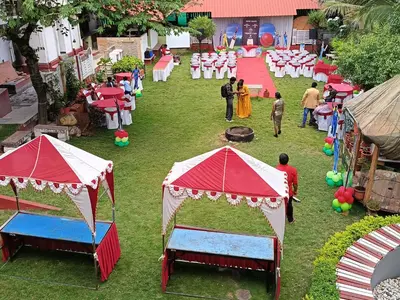 an overhead view of an event with red and white tents at The Palmyrah Tenements in Mysore