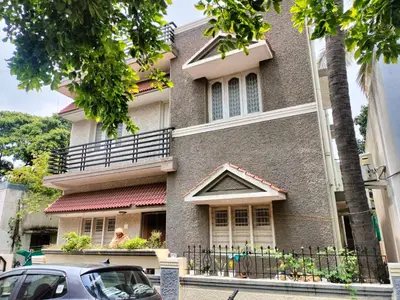a building with a car parked in front of it at PG For Men in Mysore