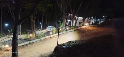 a car parked in front of a house at night at The Paul Residence