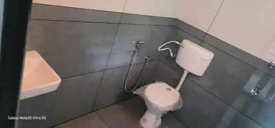 a bathroom with a toilet and a sink at The Paul Residence