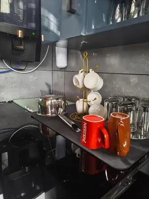 a counter with cups and utensils on it at Retreat Rivera where Serenity Meets the River in Green Island