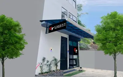 a building with a sign on the front of it at Calicut residency in Kozhikode