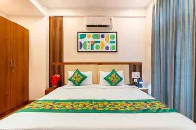 a bedroom with a bed in a room at Treebo Adithi Comforts Inn And Suites in Mysore