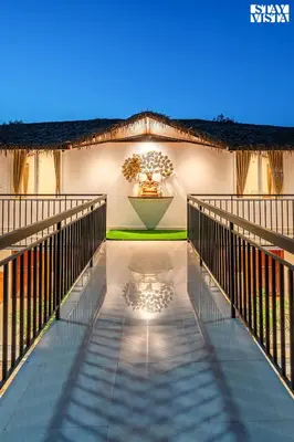 a walkway in the middle of a house at StayVista at Hermitage 4BR - Boutique Stay - Relax in Nature in Irpu