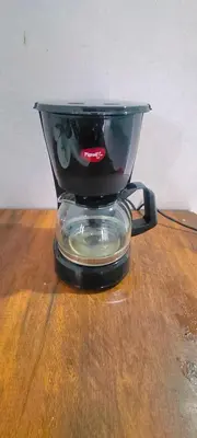 a blender sitting on top of a wooden table at Silent Stays in Kelakam