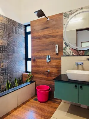 a bathroom with a sink and a mirror at Hill Brown Resort in Kalpetta