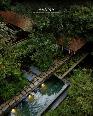 an overhead view of a garden with a pond at Avana Holiday Experiences,Wayanad in Kalpetta
