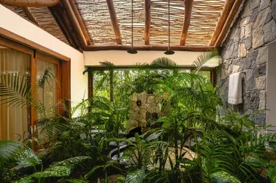 an indoor garden with plants in a building at Avana Holiday Experiences,Wayanad in Kalpetta