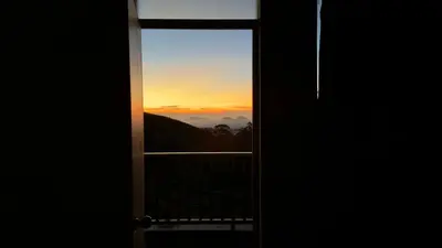 an open door with a view of the sunset at Teyt Grand View in Ketti