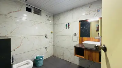 a bathroom with a sink and a mirror at Teyt Grand View in Ketti