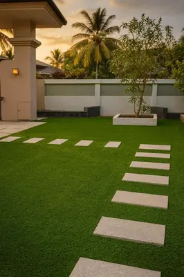 a yard with green grass and a building at Karthika Residency Parakkadavu in Nedumbassery