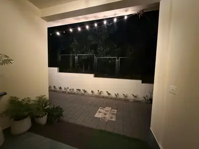 a group of birds sitting on a wall with lights at Ethnic Family Spot Wayanad in Kenichira