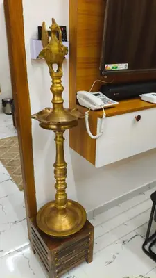 a gold table at Gurunandanam-Fully furnished Deluxe Apartment East Nada Guruvayur in Guruvāyūr