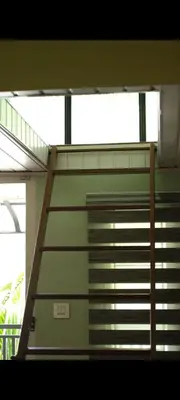 a staircase in a building with a stair case at NEST nature homestay in Kalpetta