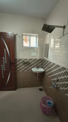 a bathroom with a sink and a window at Hideout luxe in Ooty