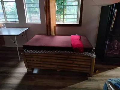 a mattress sitting on top of a bed in a room at Avichala in Mysore