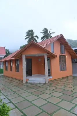 a house with an orange at Mystic Rock Staycations in Mannārakkāt