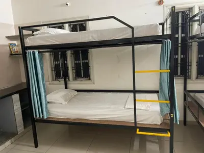 a couple of bunk beds in a room at AAKI Comforts in Mysore