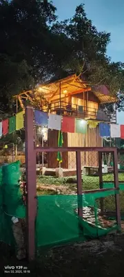 a house with clothes hanging on a fence at Wild Ni8 Club