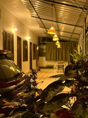 a living room with a car and a potted plant at Aqua Vista beach home's in Cochin
