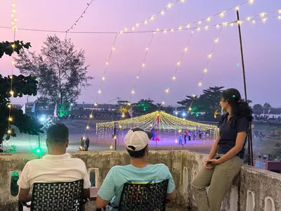 a group of three people sitting on a wall with a woman at Aqua Vista beach home's in Cochin