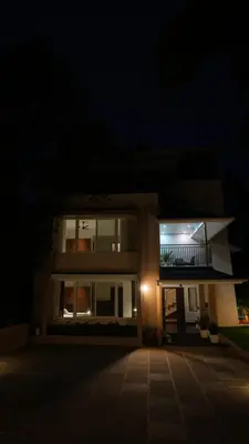 a house at night with the lights on at Mizuki Homestay in Trichūr