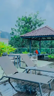 a picnic table and a gazebo on a patio at Vythiri Waves Resort l 3BR Private Pool Villa in Vayittiri