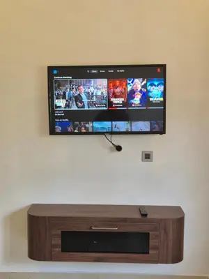 a flat screen tv hanging on a wall at Prabhu Villla Upper Deck in Perumbavoor