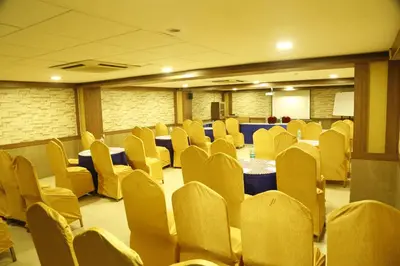 a conference room with chairs and a table in it at HOTEL GRAND PLAZzA in Coimbatore