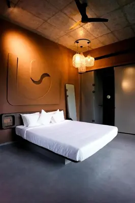 a bedroom with a large white bed in a room at Ayana Villa By KPM in Varagampadi